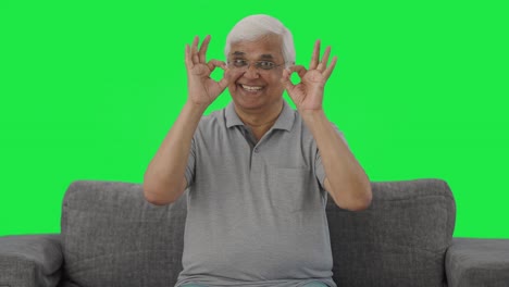 Happy-Indian-old-man-showing-okay-sign-Green-screen