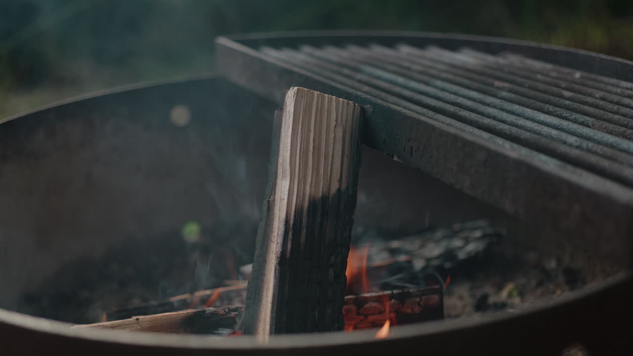Campfire in the pacific northwest forest smoldering