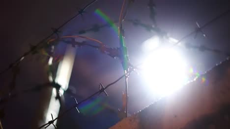 barbed wire fence at night