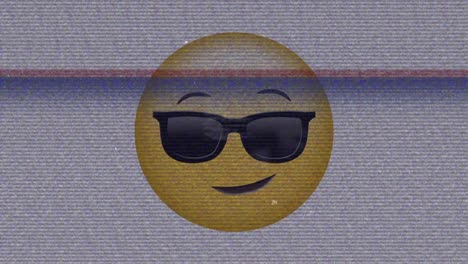 Animation-of-sunglasses-emoji-icon-over-noises-on-screen