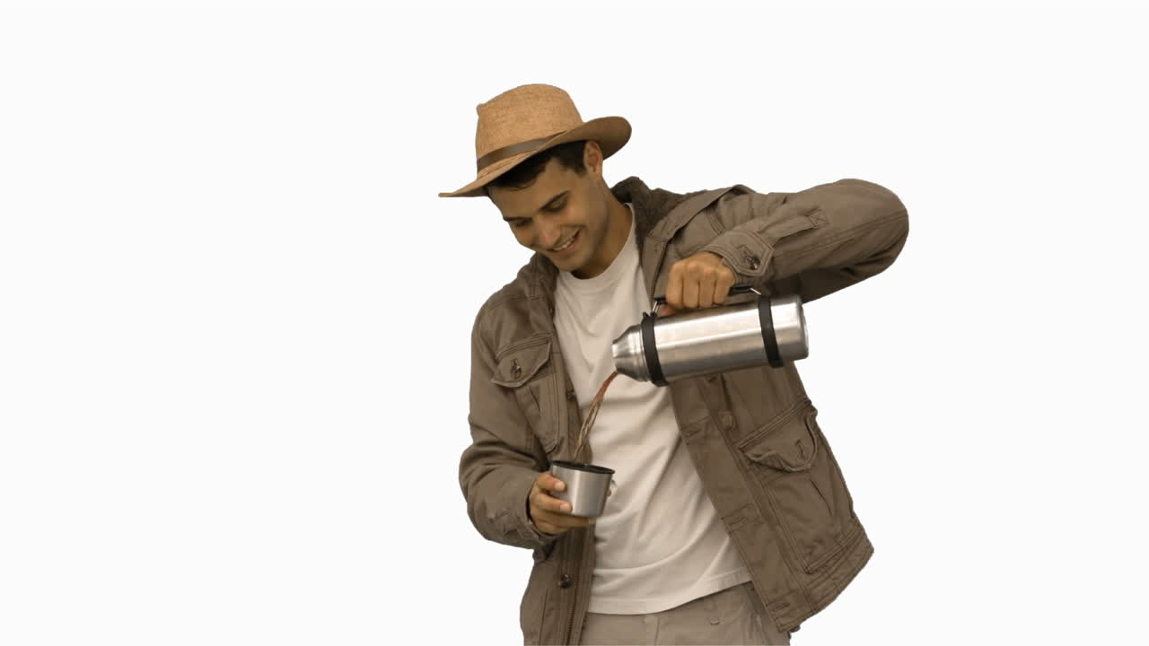 Man pouring coffee from a vacuum flask on white screen