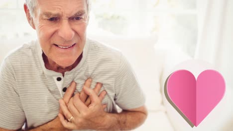 animation of heart icon over senior caucasian man touching his chest