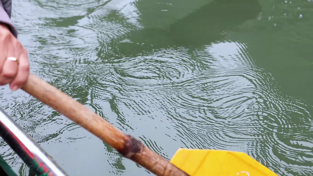 Paddle moving through water in Vietnam
