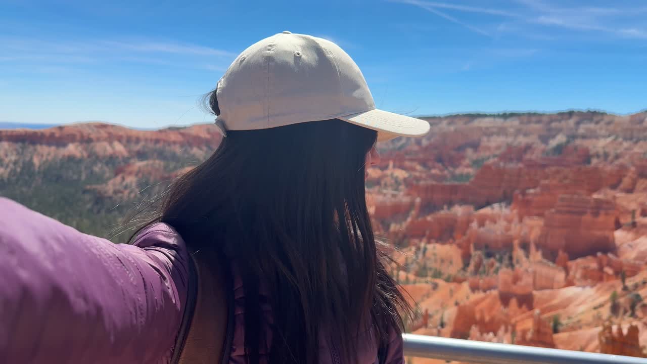 Happy Woman Taking Selfie Video at Scenic Bryce Canyon