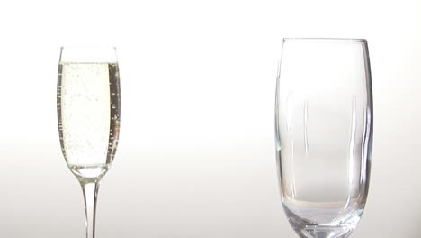 animation of burning paper over champagne glasses on white background