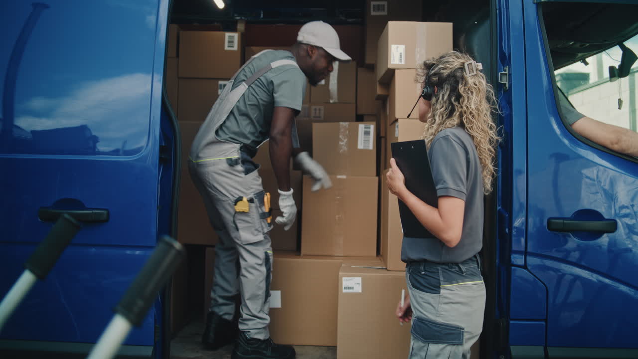 Delivery Team Managing Packages in a Van