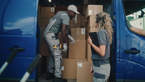 delivery team managing packages in a van