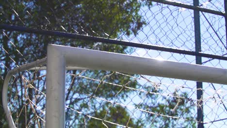 soccer ball hitting the goal post in slow motion