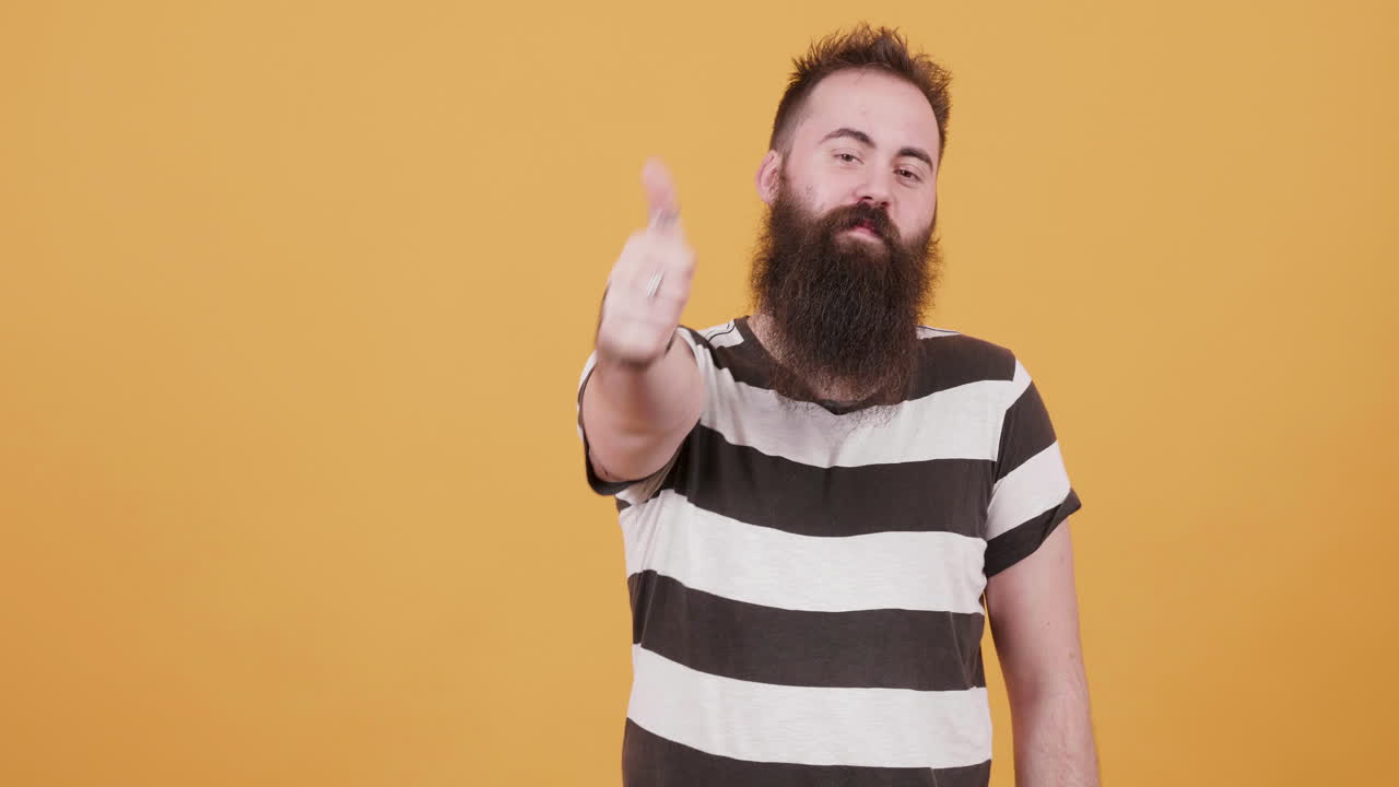 Man with beard in striped shirt