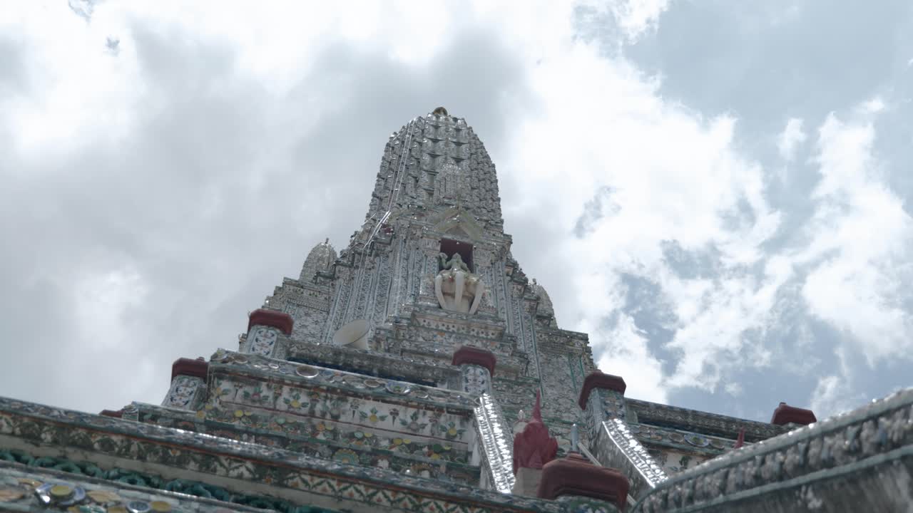 Footage of the famous Buddhist temple Wat Arun, also known as the Temple of Dawn, located on the Chao Phraya River in downtown Bangkok, Thailand