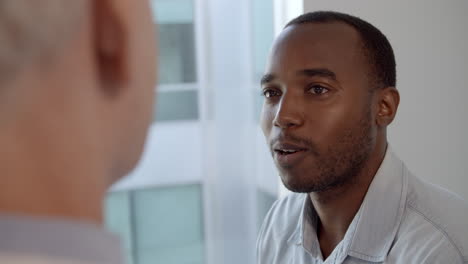 Doctor-Meeting-With-Male-Patient-Shot-In-Slow-Motion-On-R3D