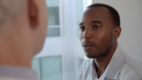 doctor meeting with male patient shot in slow motion on r3d