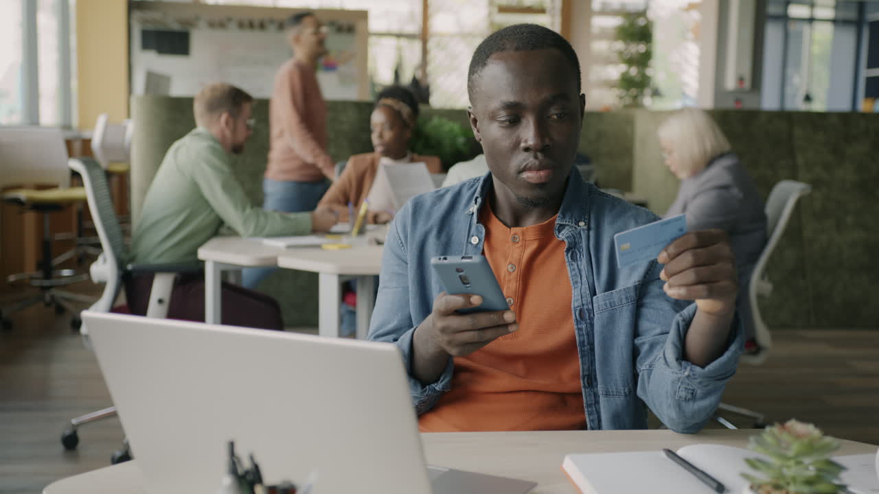 Man Paying Online at the Office