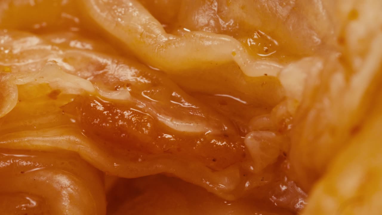 Close-up of texture fermented spicy cabbage kimchi with in can. Preservation of vegetables in glass jars. Fermentation preserved kimchi cabbage with spices macro. Asian cuisine.