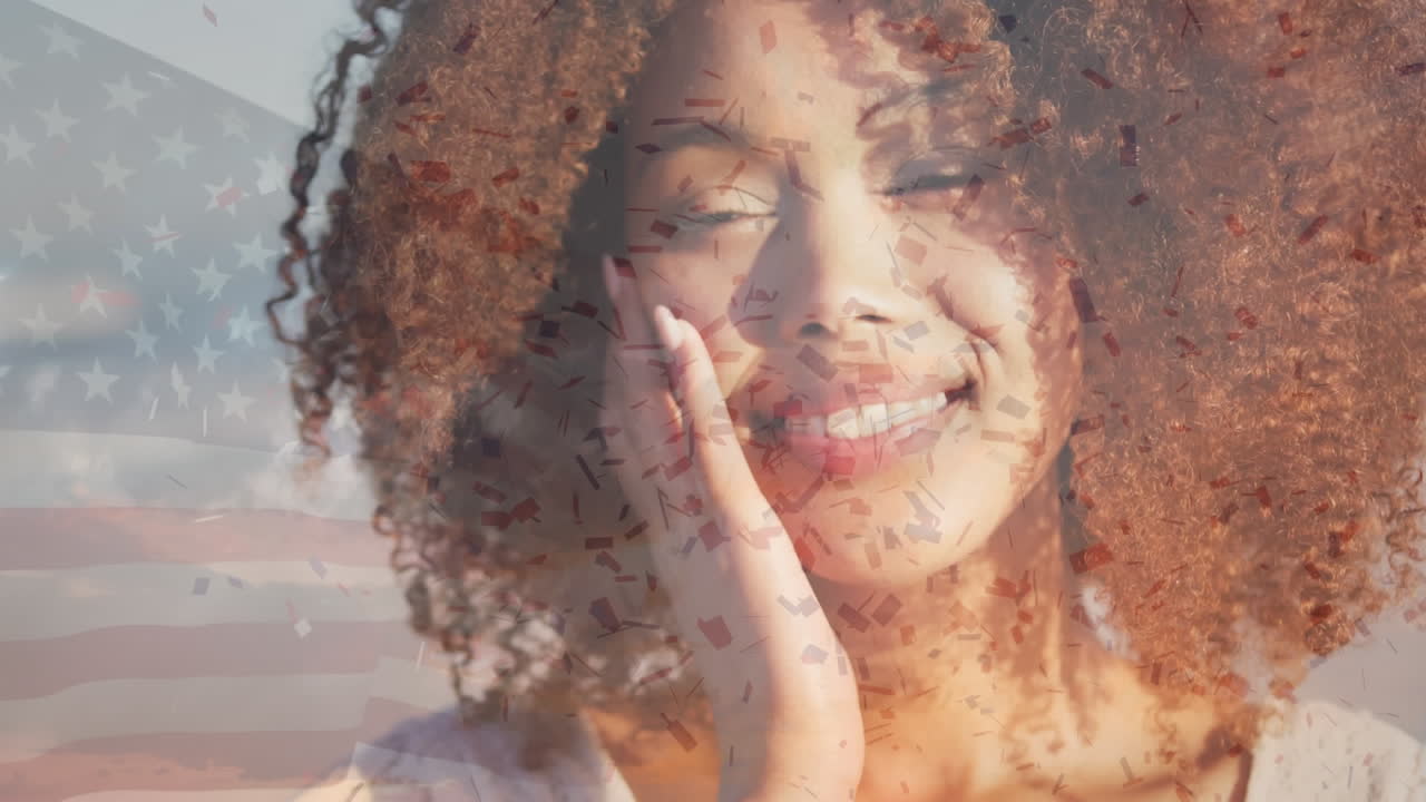 animación de la bandera de los estados unidos de américa sobre una feliz mujer afroamericana en la playa