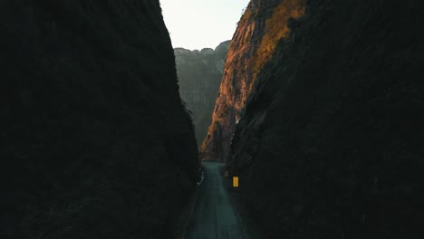 amazing rainforest mountain road with big rocky walls on both sides, serra do corvo branco, grão pará, santa catarina, brazil