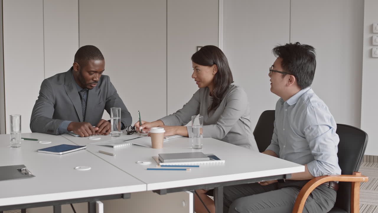 Coworkers Brainstorming during Business Meeting
