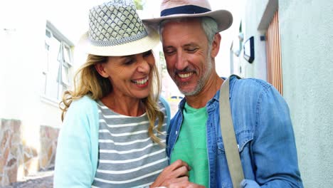 mature couple is looking a smartphone