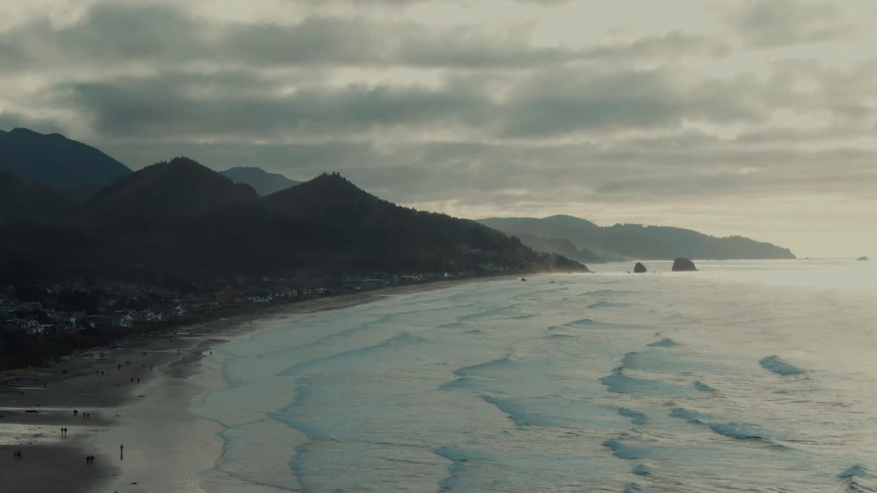 4k Aerial beach on west coast of Oregon with mountains in background Drone truck right