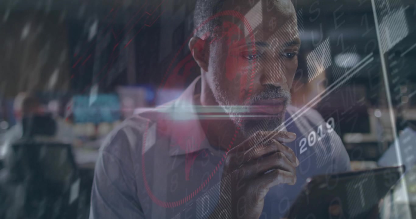 Man in technology center tapping tablet screen and swiping year markers to analyze data trends