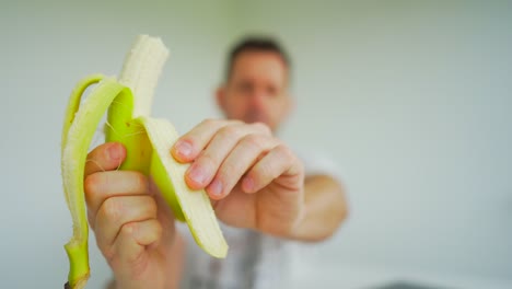 men eat a banana