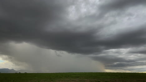 Lightening-strikes-from-a-dark-cloud-into-a-field-during-monsoon-storm