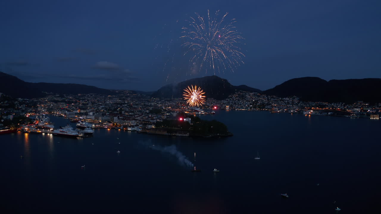 Spectacular Fireworks Display Over a Coastal City at Night