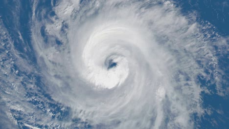 a satellite view directly above the eye of a rotating hurricane - seamless looping.