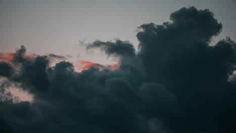 sunset time lapse with orange and teal clouds in 4k