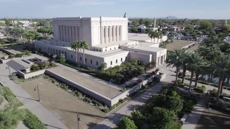 People-Leaving-Mesa-Arizona-Temple,-Tracking-Aerial-Shot