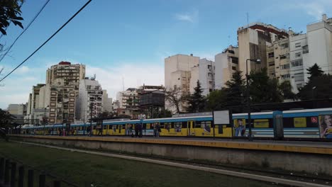 panoramic establishing shot of buenos aires city and caballito railway station over sunset skyline