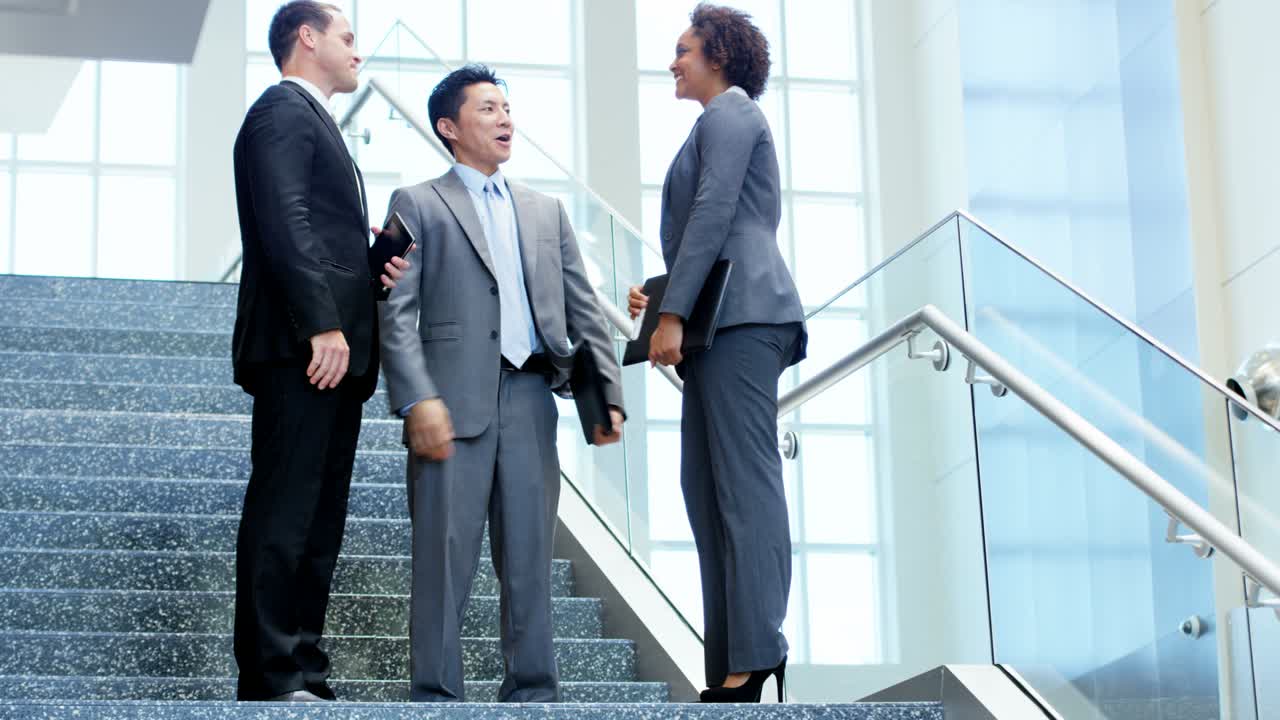 Male female multi ethnic business team using technology