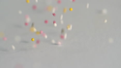 sprinkles falling onto grey surface