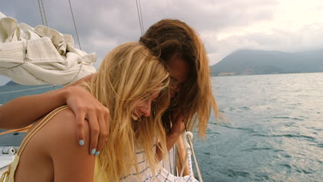 happy friends hugging and laughing on a cruise