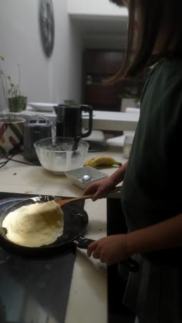Child Cooking Pancakes