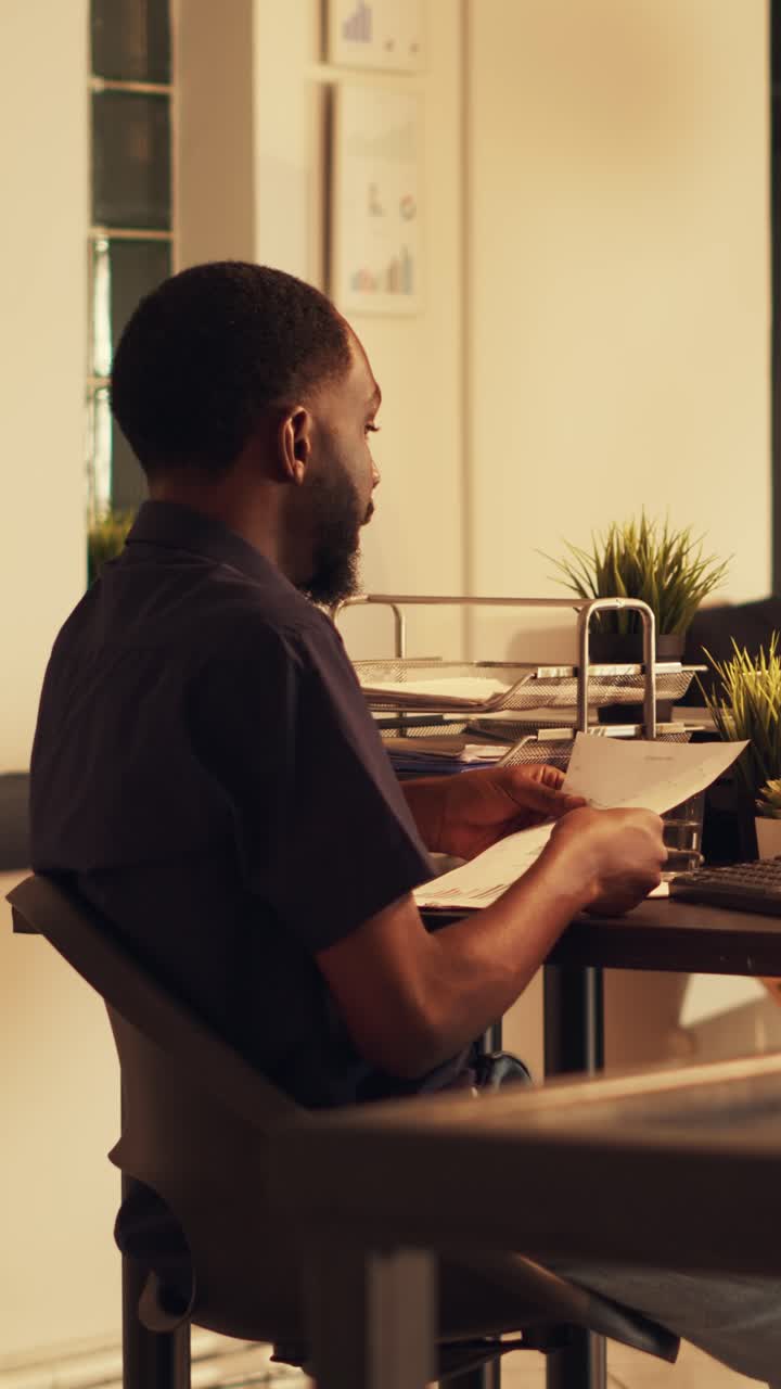 Vertical video: Diverse people working with marketing sales to plan project