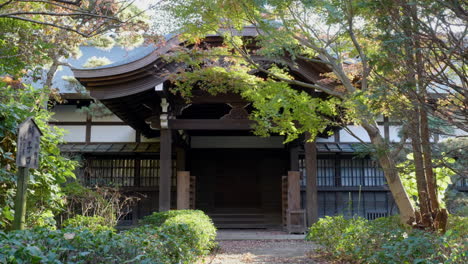 autumn sunset at one of the entrances to an ancient zen buddhist temple in japan