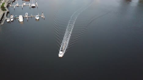 boat cruising on docklands river in melbourne