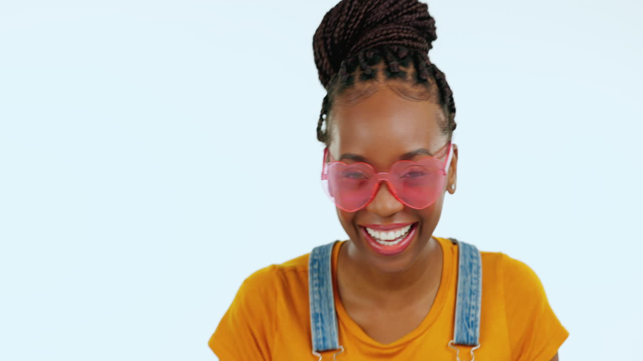 Wink, laughing and face of a black woman
