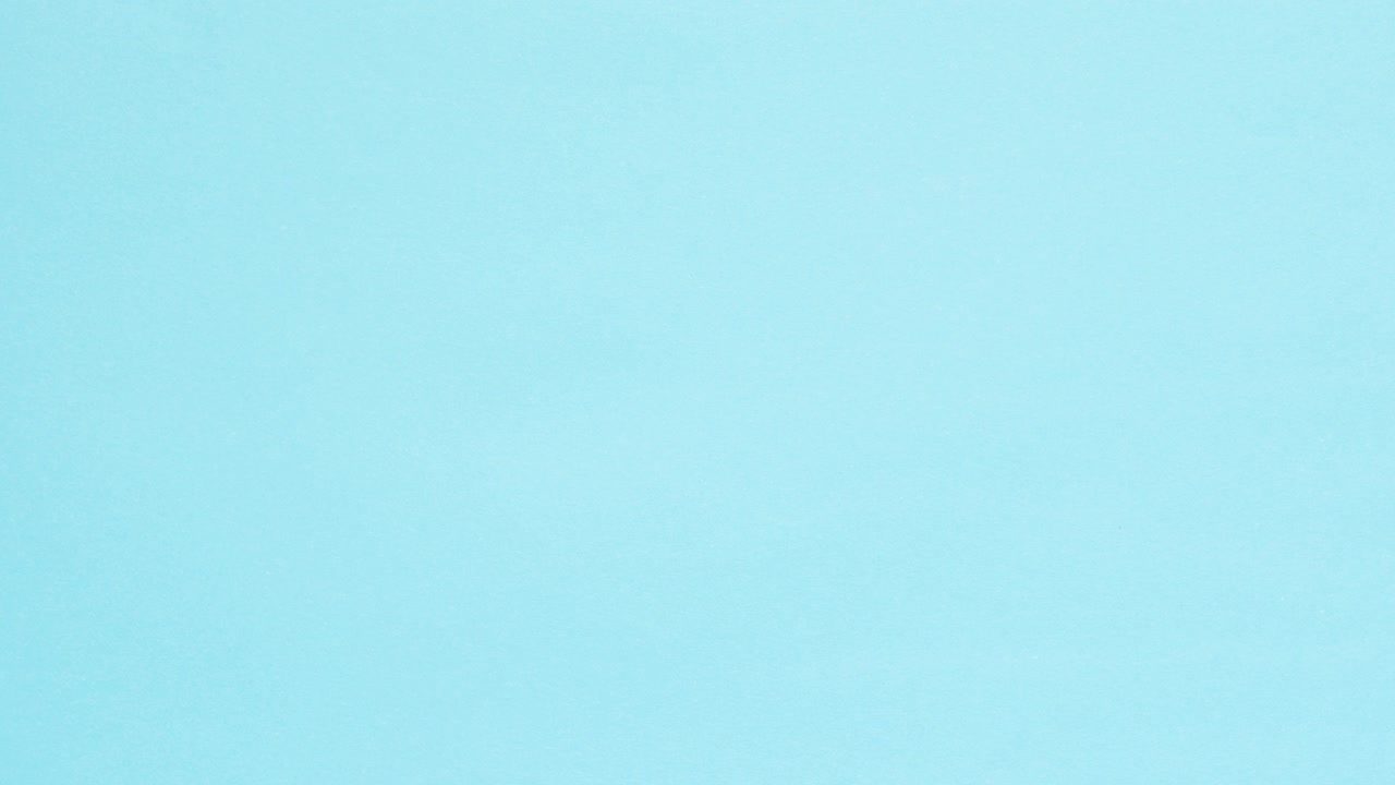 Blue crumpled paper unfolds then refolds on pink in stop motion transition