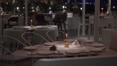 front view of stylish and light dining table in restaurant wide shot, close up shot, push in shot