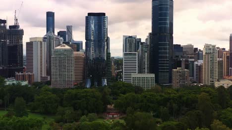 flyover brisbane city botanic gardens capturing downtown cityscape of high rise buildings in central business district at sunset