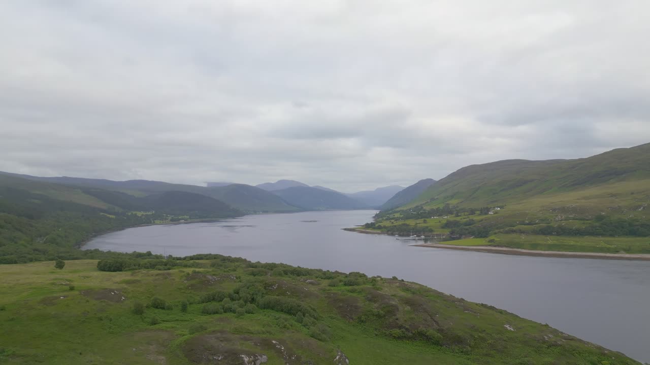 Scenic Loch Landscape with Mountains and Greenery