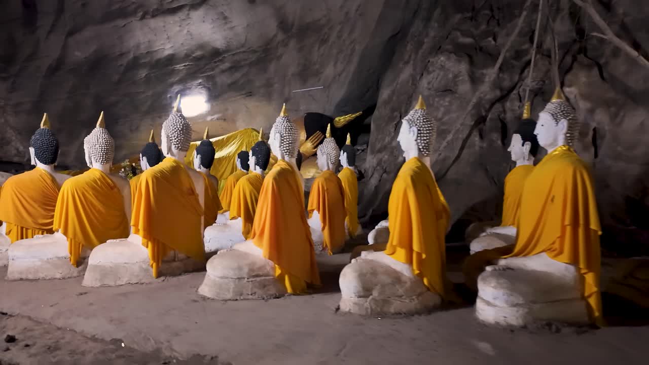 Reclining Budda cave sanctuary near Pran Kiri Khan Thailand. A deep cave with buddha relics and a long path on the southern coast of thailand. Wat Ao Noi is next to this temple cave