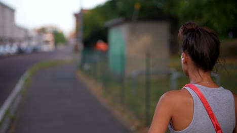 young woman walking in city street