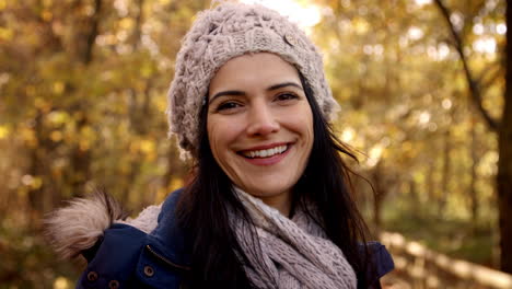 Portrait-Of-Attractive-Woman-On-Walk-In-Autumn-Countryside