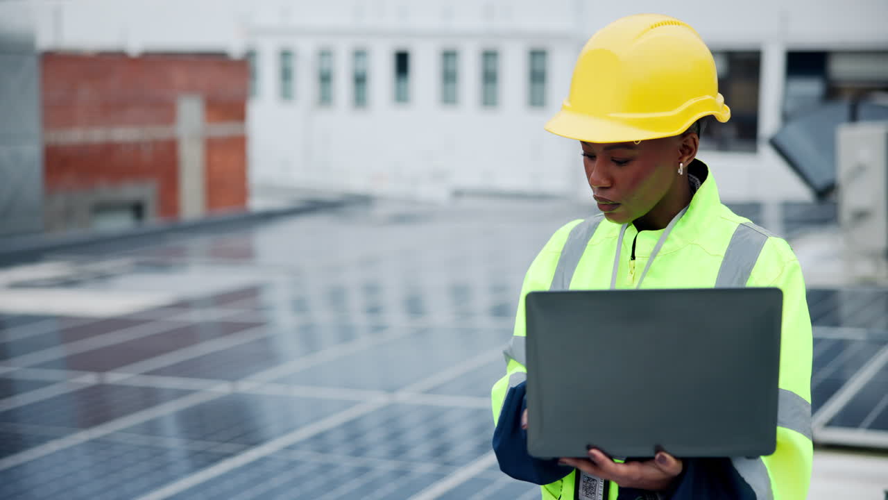 Female Engineer Inspecting Solar Panels on Rooftop