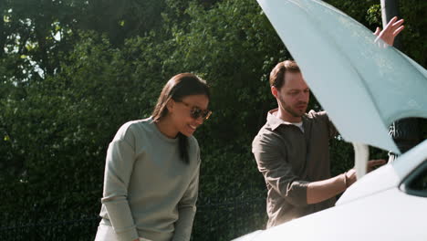 Opening-car-hood-during-driving-lesson