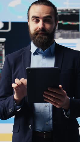 vertical video professional businessman analyzing info and finance charts on digital dashboard