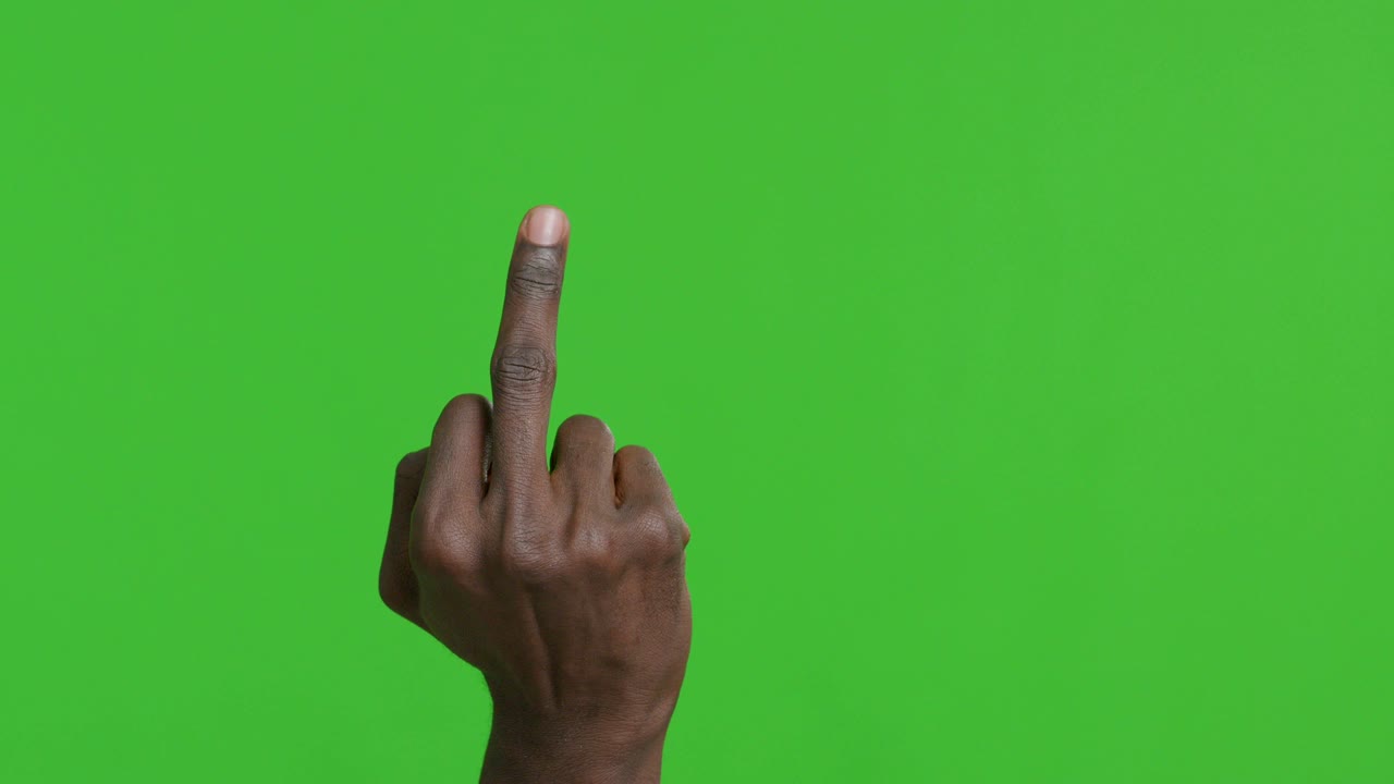 Man raising middle finger as symbol of offense